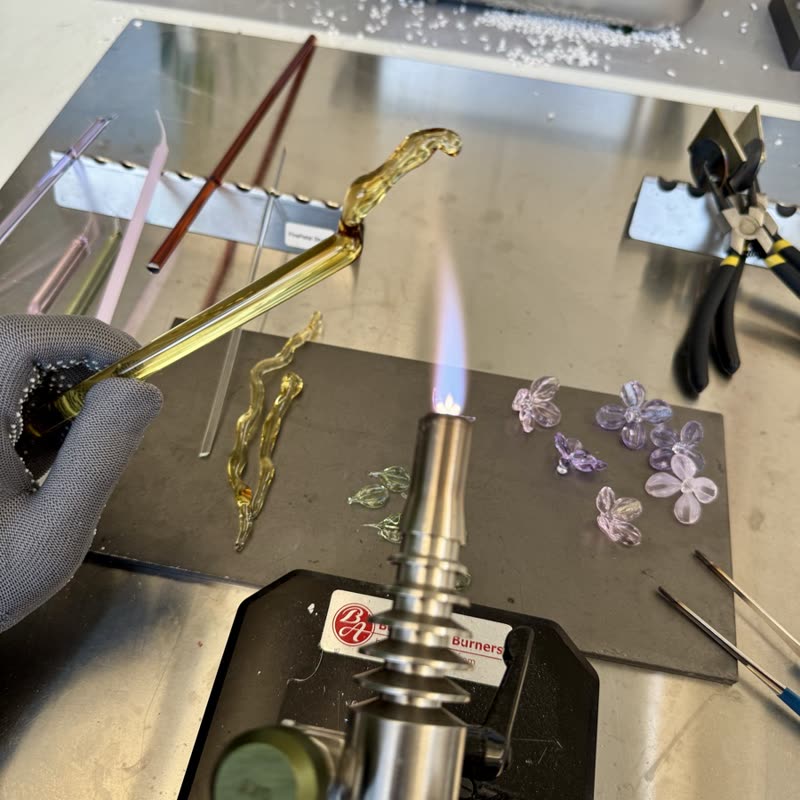 Shaping glass at a torch flame
